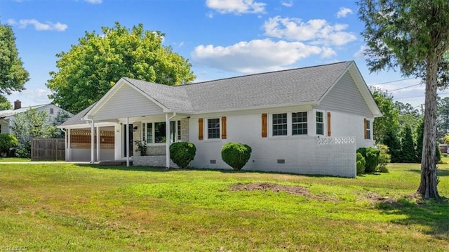 ranch-style home featuring a front yard