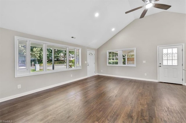 unfurnished living room with high vaulted ceiling, dark hardwood / wood-style floors, and ceiling fan