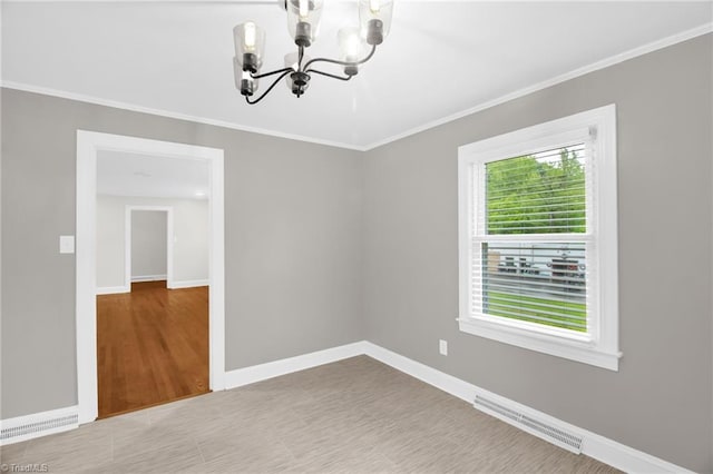 unfurnished room with a chandelier, crown molding, baseboards, and wood finished floors