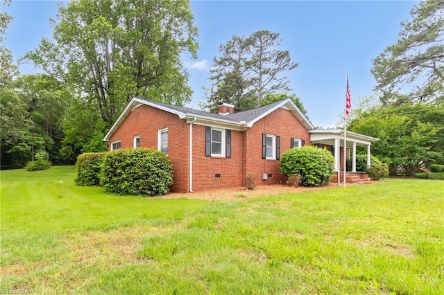 view of property exterior with crawl space, brick siding, and a lawn