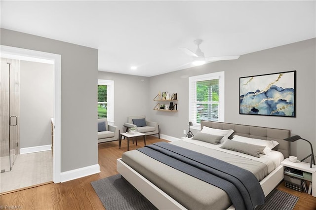 bedroom with wood finished floors, baseboards, recessed lighting, and a ceiling fan