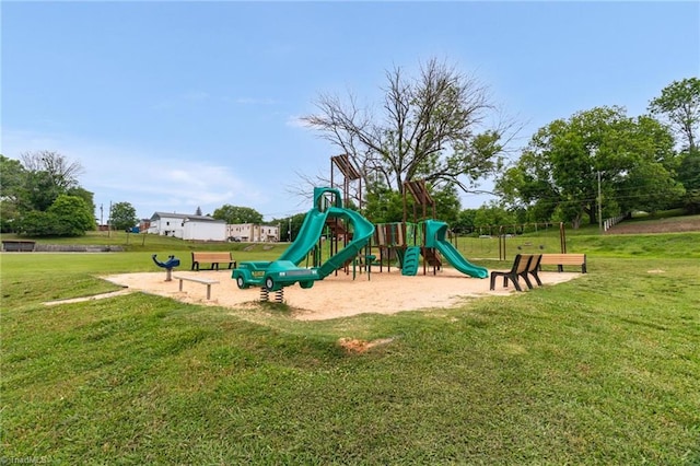 communal playground featuring a yard