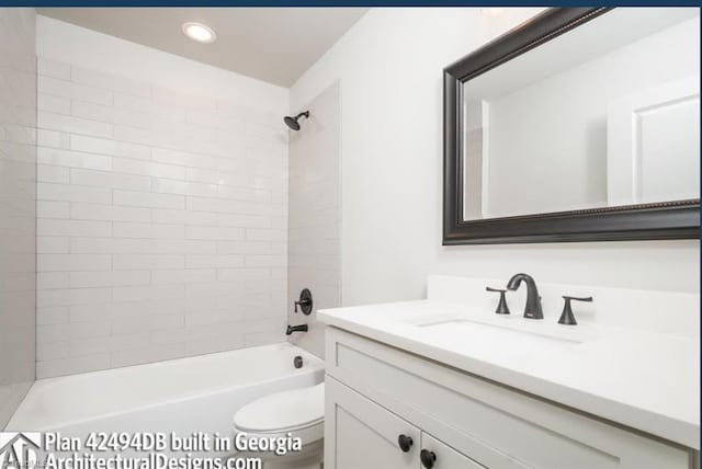 full bathroom with tiled shower / bath combo, vanity, and toilet