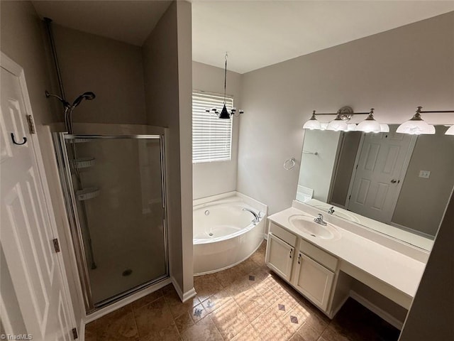 bathroom featuring a stall shower, a garden tub, vanity, and tile patterned floors