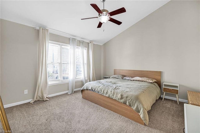 bedroom with lofted ceiling, carpet, baseboards, and ceiling fan