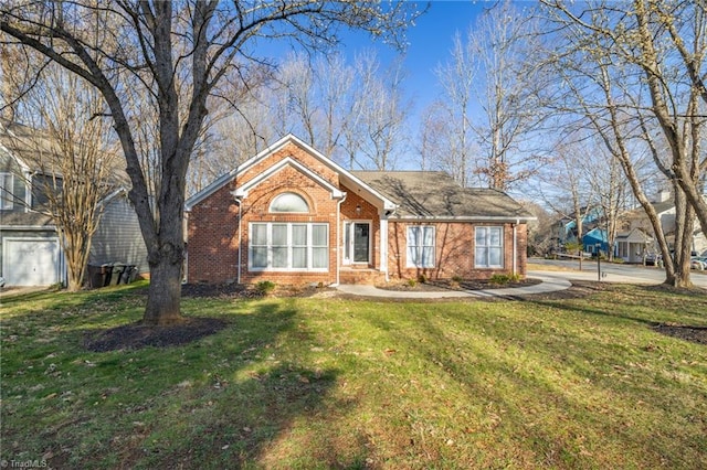 ranch-style house featuring brick siding and a front lawn