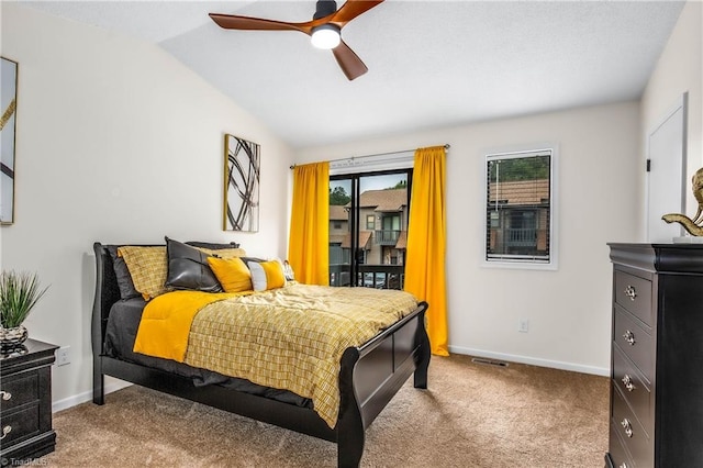 bedroom with lofted ceiling, ceiling fan, and light colored carpet