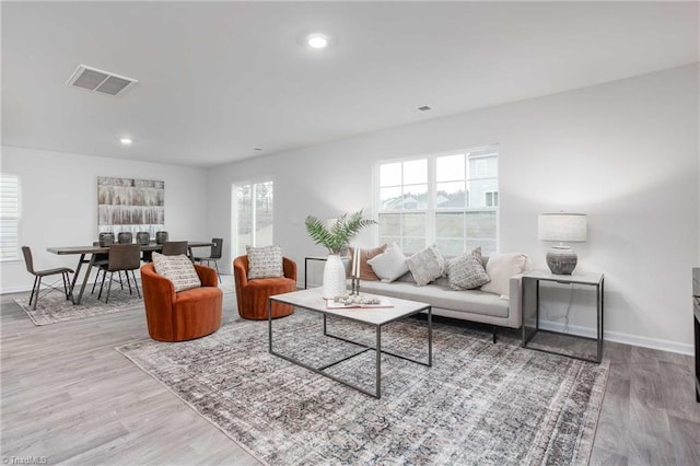 2126 Monk Dr, Haw River, NC 27258 - living room featuring baseboards, visible vents, wood finished floors, and recessed lighting