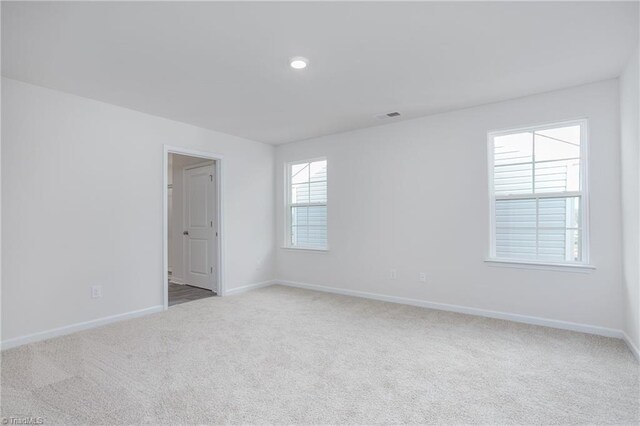 2126 Monk Dr, Haw River, NC 27258 - carpeted spare room featuring baseboards and visible vents