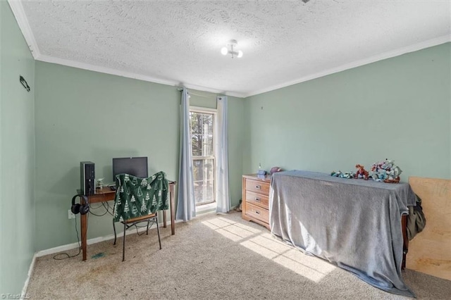 carpeted bedroom with ornamental molding and a textured ceiling