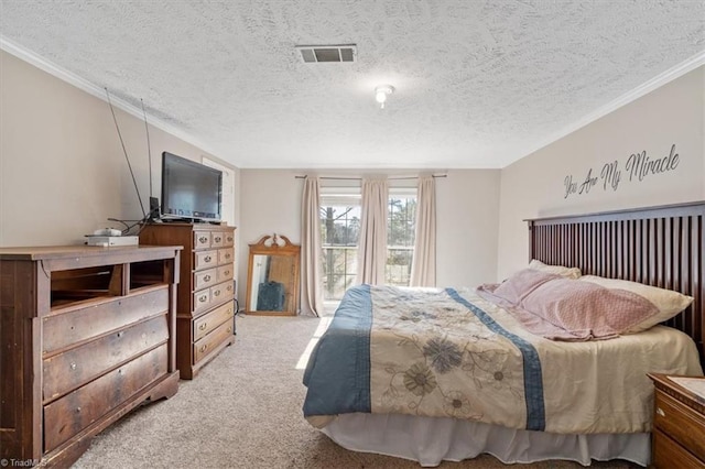 bedroom featuring light colored carpet and a textured ceiling