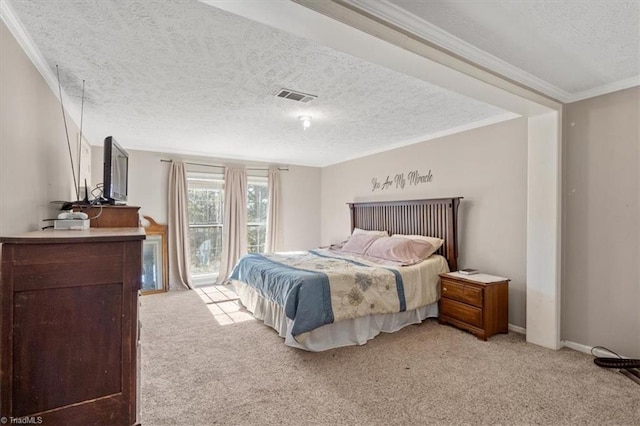 carpeted bedroom featuring crown molding and a textured ceiling