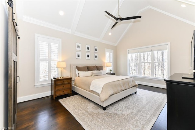 bedroom with a barn door, ceiling fan, dark hardwood / wood-style floors, vaulted ceiling with beams, and ornamental molding