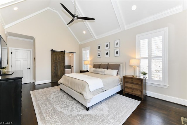 bedroom featuring ceiling fan, a barn door, lofted ceiling with beams, and multiple windows