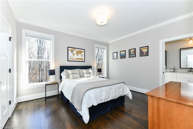 bedroom featuring dark wood-type flooring, multiple windows, ensuite bathroom, and ornamental molding