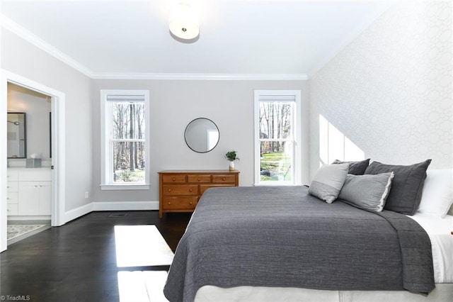 bedroom featuring dark wood-type flooring, ensuite bathroom, and crown molding