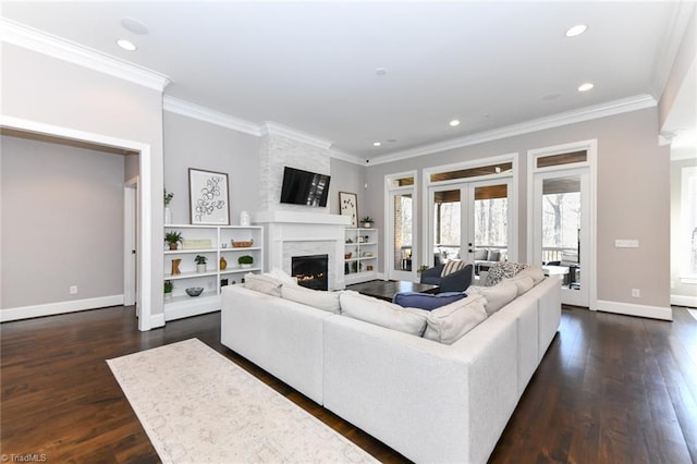 living room with french doors, dark hardwood / wood-style flooring, and ornamental molding