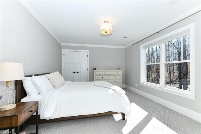 bedroom with light carpet and ornamental molding