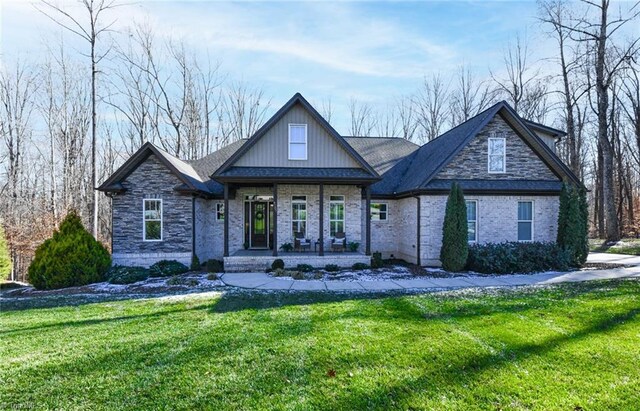 view of front of home featuring a front lawn and a porch