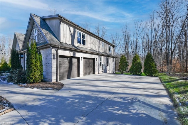 view of side of home featuring a garage