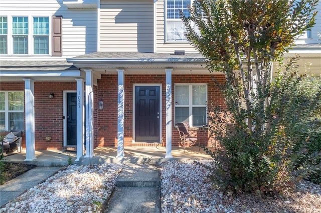 doorway to property featuring a porch