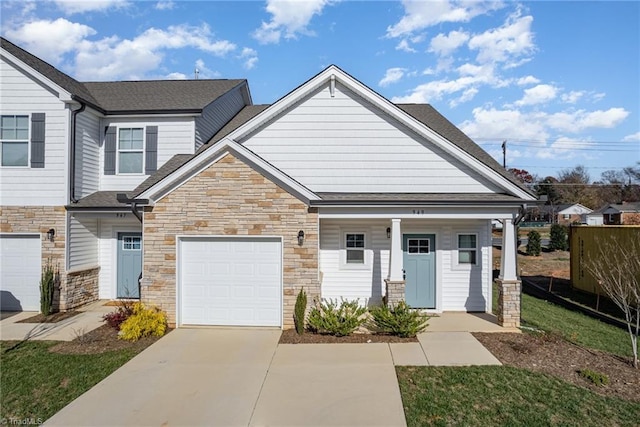 view of front of home with a garage and a porch