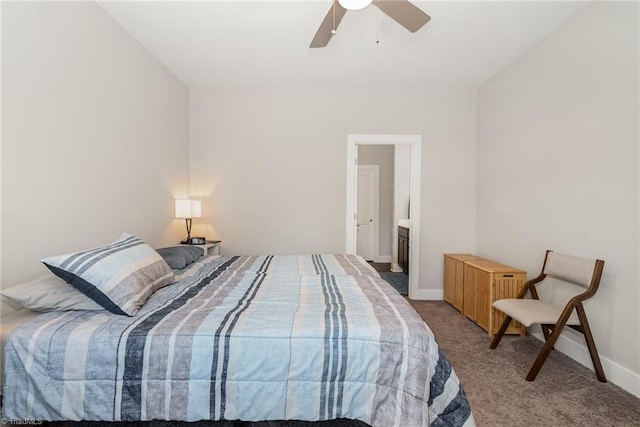 bedroom with ceiling fan, ensuite bath, and carpet floors