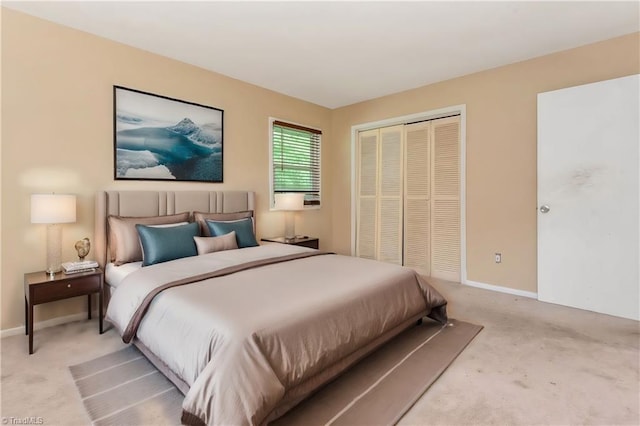 bedroom featuring light carpet and a closet