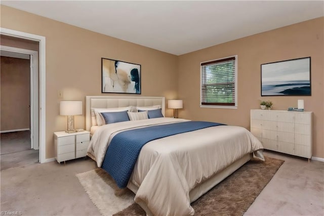 bedroom with light colored carpet