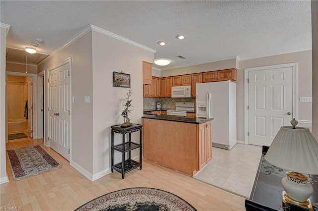 kitchen with white appliances, light wood-type flooring, a kitchen island, ornamental molding, and decorative backsplash