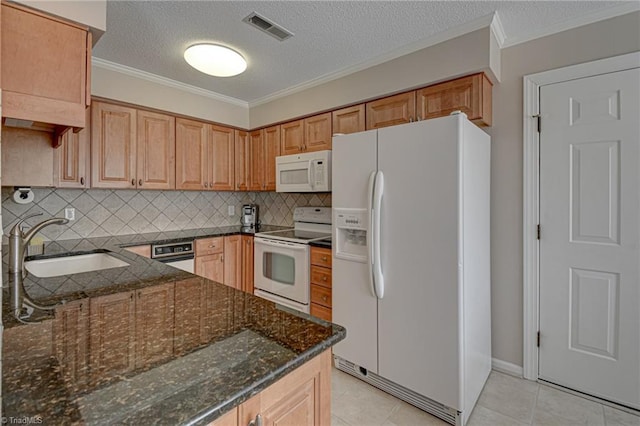 kitchen featuring tasteful backsplash, white appliances, dark stone counters, ornamental molding, and sink