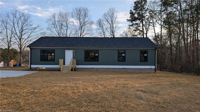 view of front of house with a yard