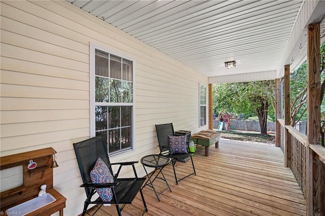 wooden deck featuring fence