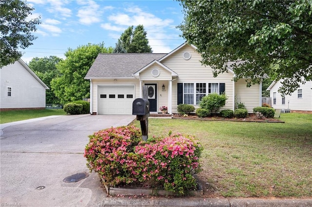 ranch-style home with a garage, driveway, a front lawn, and a shingled roof