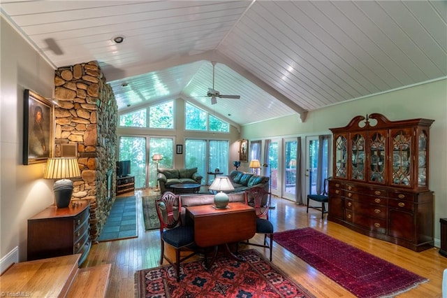 living room featuring light hardwood / wood-style floors, ceiling fan, vaulted ceiling, and wooden ceiling