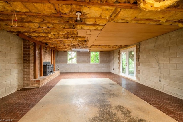 basement with a fireplace and plenty of natural light