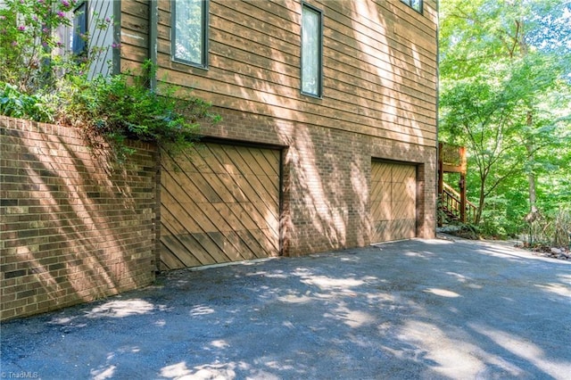 view of side of home with a garage