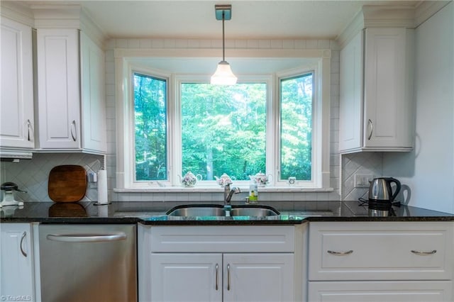 kitchen with sink, white cabinetry, hanging light fixtures, backsplash, and stainless steel dishwasher