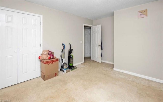 interior space featuring baseboards and a textured ceiling