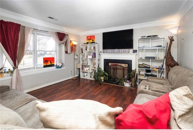 living room featuring a textured ceiling, wood finished floors, visible vents, and ornamental molding