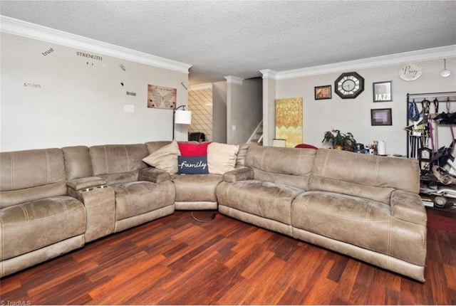 living room with stairs, crown molding, wood finished floors, and a textured ceiling