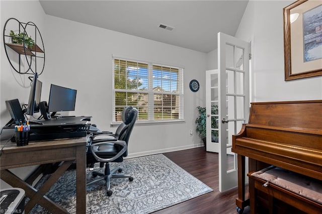 office area featuring lofted ceiling, dark wood-type flooring, and french doors