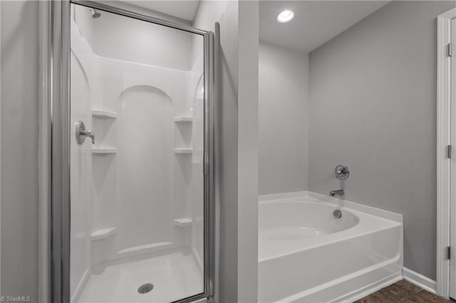 bathroom with plus walk in shower and tile patterned flooring