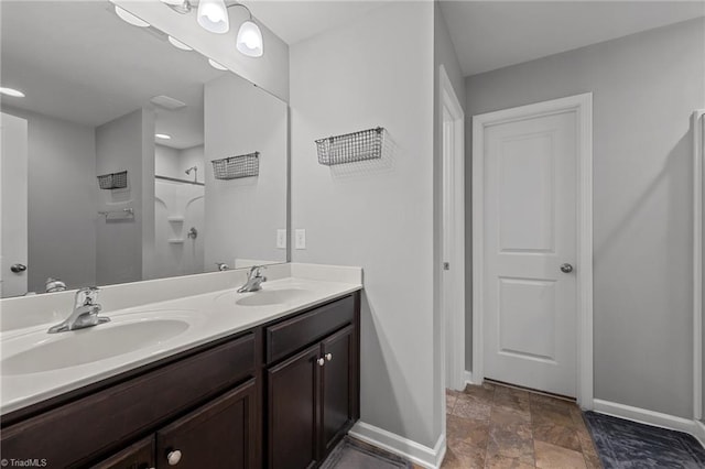 bathroom featuring vanity and a shower