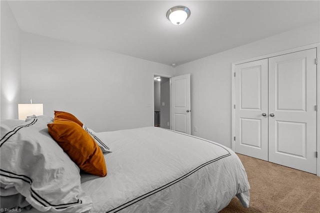 bedroom with carpet floors and a closet