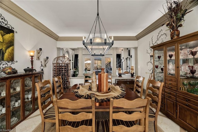 dining area with ornamental molding and a chandelier