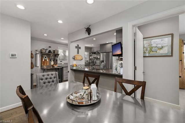 dining space with dark wood-type flooring