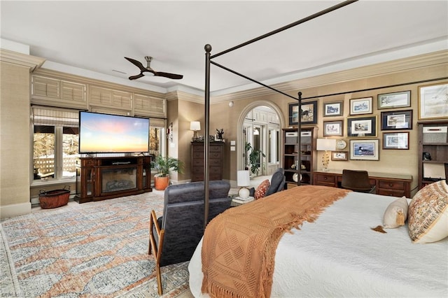 bedroom with ceiling fan and crown molding