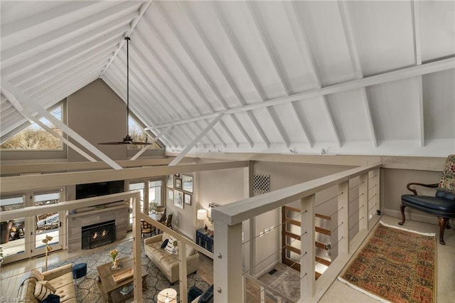 interior space featuring ceiling fan and a fireplace