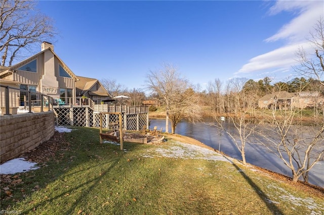 view of yard featuring a deck with water view